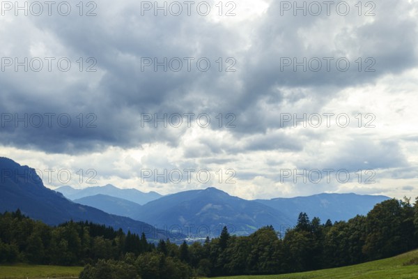 Dramatic clouds over mountains and forests in a valley, Gesäuse, Styria, Austria