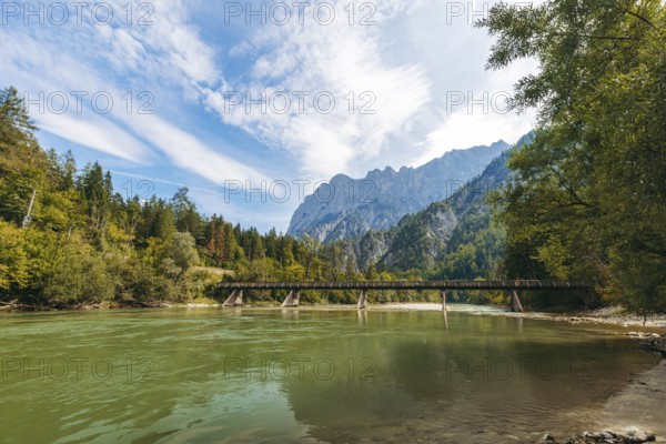 Wooden bridge over the Enns with stony bank and Reichenstein group in the background, Gesäuse, Styria, Austria