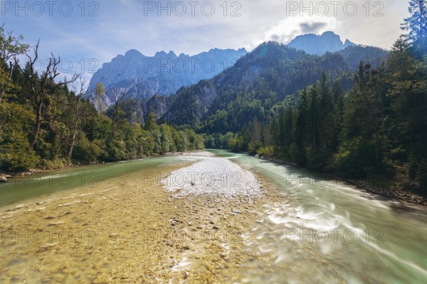 Enns with gravel bank surrounded by wooded banks, Reichenstein group in the background, Gesäuse, Styria, Austria