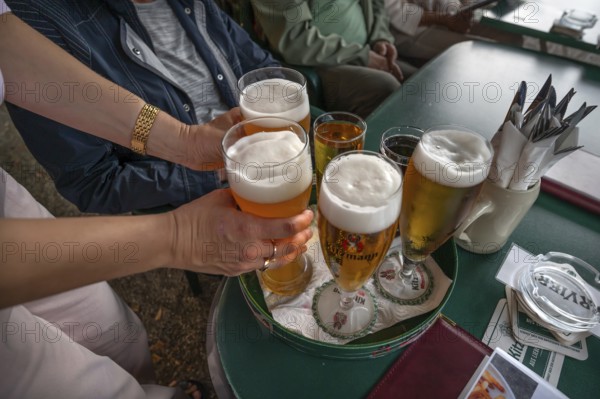Drinks are served on a tray in a garden restaurant, Franconia, Bavaria, Germany