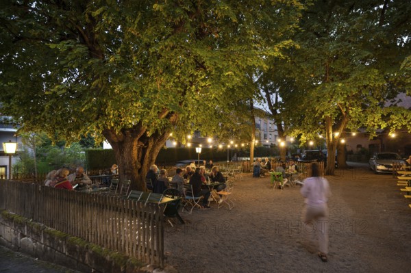 Illuminated garden restaurant in the evening, Erlangen, Middle Franconia, Bavaria, Germany