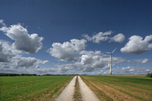 Field path and wind turbine in Franconian landscape, Karsberg, Upper Franconia, Bavaria, Germany