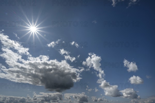 Cloudy sky with sun star, Bavaria, Germany