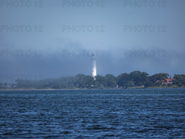 Long Erik lighthouse, Long Erik, on the northern tip of the Swedish island of Stora grundet in the Baltic Sea, in fog, Stora grundet, Öland, Sweden