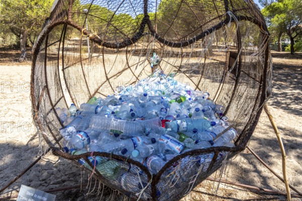 Collection containers for PET bottles, containers, plastic bottles, Portugal has no deposit system, but recycles heavily, tourists should dispose of their empty bottles here instead of on the beach or in rubbish bins, on Praia do Barril beach on the islands of Tavira, Praia da Ilha de Tavira, Algarve, Portugal