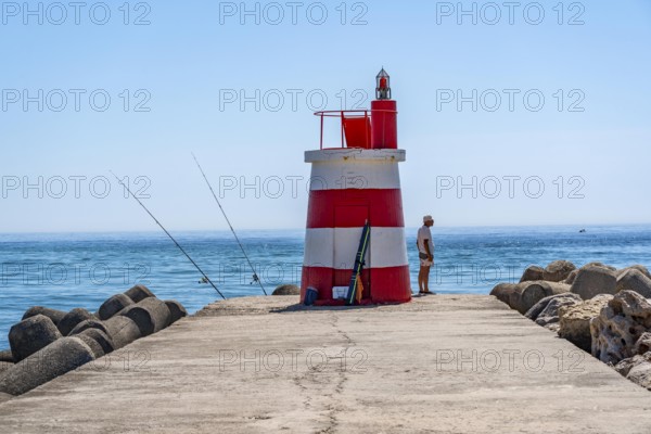 Lighthouse at the kilometre-long beach Praia da Ilha de Tavira, on the island in front of Tavira, port lighthouse to the harbour entrance, Algarve, Farol de Tavira Molhe Öste, Portugal