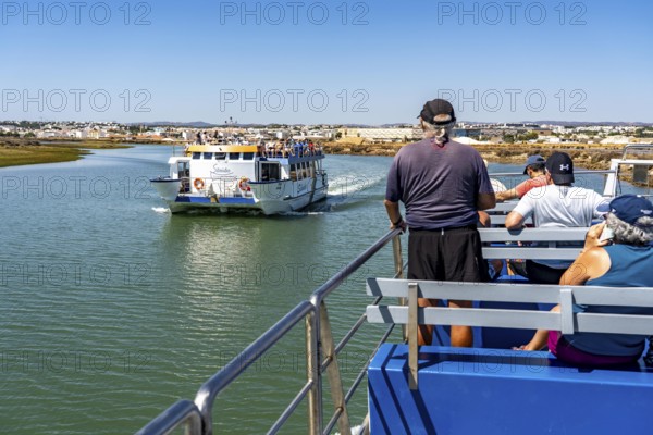 Ride on the Silnido ferry from Tavira on the Gilão River to the beach Praia da Ilha de Tavira, on the island off Tavira, Algarve, Portugal
