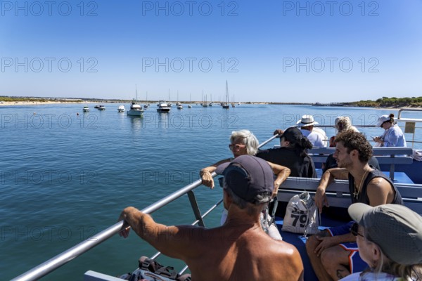 Ride on the Silnido ferry from Tavira on the Gilão River to the beach Praia da Ilha de Tavira, on the island off Tavira, Algarve, Portugal