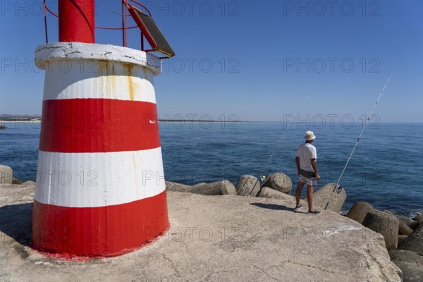 Lighthouse at the kilometre-long beach Praia da Ilha de Tavira, on the island in front of Tavira, port lighthouse to the harbour entrance, Algarve, Farol de Tavira Molhe Öste, Portugal
