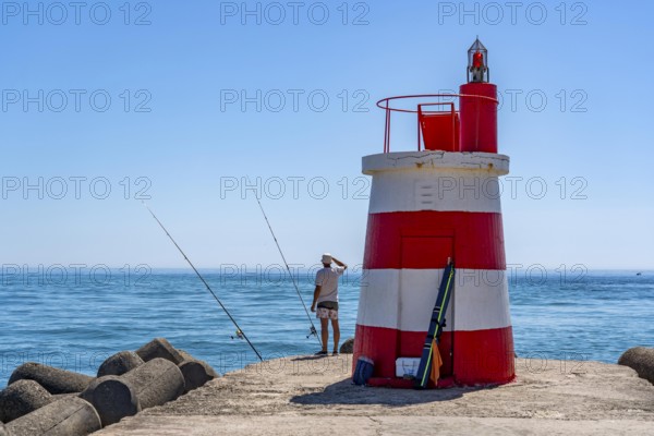 Lighthouse at the kilometre-long beach Praia da Ilha de Tavira, on the island in front of Tavira, port lighthouse to the harbour entrance, Algarve, Farol de Tavira Molhe Öste, Portugal
