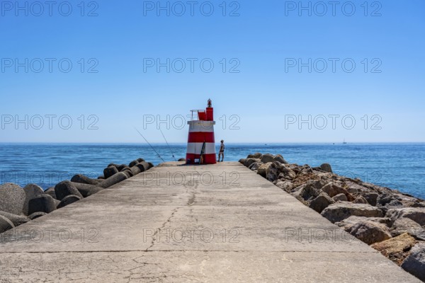 Lighthouse at the kilometre-long beach Praia da Ilha de Tavira, on the island in front of Tavira, port lighthouse to the harbour entrance, Algarve, Farol de Tavira Molhe Öste, Portugal