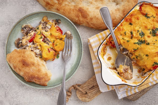 Madame Bovary's Georgian dish, chicken fillet with mushrooms, tomatoes and cheese, baked in a mold