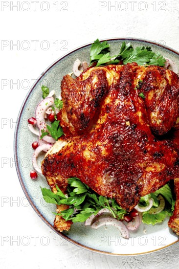 Whole fried chicken, with spices, grilled chicken, on a light background, top view, homemade, no people