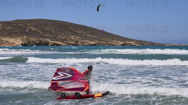 Windsurfer on the water with vivid colours and clear sky, Prasonisi, beach, surf, windsurfer, kite surfer, waves, south coast, Rhodes, Dodecanese, Greek Islands, Greece