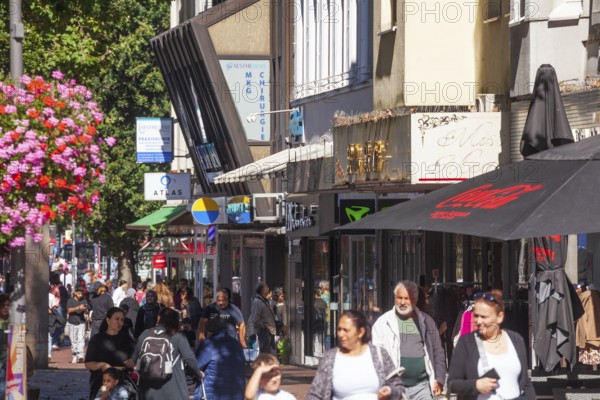 Pedestrian zone and shopping street Lüneburger Straße with many people and shops, Harburg, Hamburg, Germany