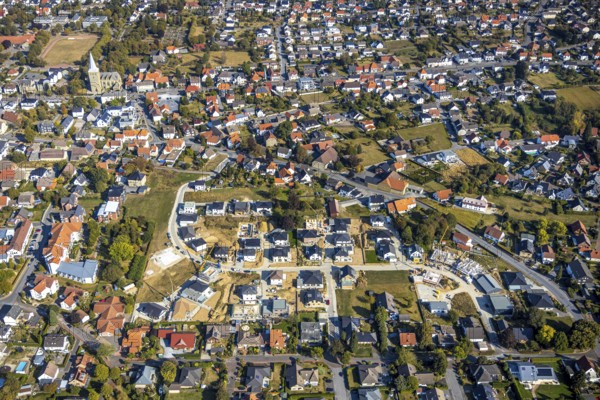 Aerial view, construction site Katharinenweg, catholic church St.-Pankratius, Anröchte, district of Soest, North Rhine-Westphalia, Germany, place of worship, DE, Europe, football pitch, Anröchte local authority, religious community, place of worship, property tax, holy site, real estate, church, parish, denomination, district of Soest-Buch, KreisSoestBuch, aerial view, aerial photography, aerial photography, religion, religious site, sports field, overview, bird's-eye view, residential area, living and life, residential area, residential buildings, quality of life, residential neighbourhood, housing estate, birds-eyes view, overview