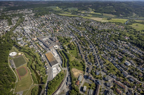 Aerial view, river Ruhr, sports facility, round gymnasium, sports ground SV Arnsberg 09, R.D.M. Arnsberg GmbH Papierfabrik, Arnsberg, Sauerland, Hochsauerlandkreis, North Rhine-Westphalia, Germany, DE, Europe, commercial enterprises, commercial space, commercial area, commercial location, commercial use, property tax, real estate, aerial view, aerial photography, aerial photography, local view, urban area, overview, bird's eye view, residential complex, living and life, residential area, residential buildings, birds-eyes view, overview