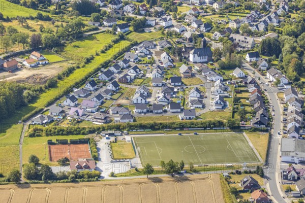 Holzen district, Holzen 1947 e.V. sports club, Am Glockenturm development area, Catholic church, St. Johanneskirche Holzen, Arnsberg, Sauerland, North Rhine-Westphalia, Germany, DE, Europe, aerial view, birds-eyes view, aerial photography, aerial photography, overview, bird's eye view