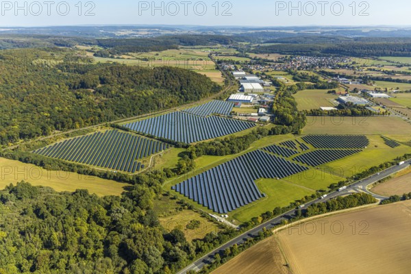 Aerial view, solar park, at the federal road B64, Herste, Bad Driburg, Ostwestfalen-Lippe, North Rhine-Westphalia, Germany, DE, Europe, shapes and colours, open space photovoltaic plant, aerial view, aerial photography, aerial photography, OLWBUCH, OWL, OWL-Buch, Ostwestfalen, photovoltaic, photovoltaic system, solar, solar system, solar energy, solar power plant, solar energy, overview, bird's-eye view, birds-eyes view, overview, alternative energy, renewable energy, solar panel