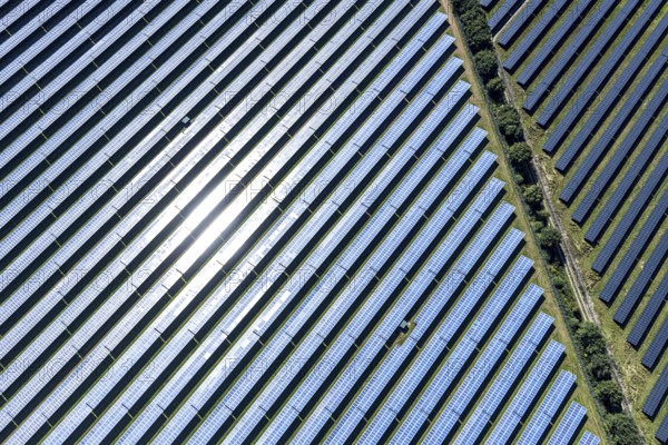 Aerial view, solar park, at the federal road B64, Herste, Bad Driburg, Ostwestfalen-Lippe, North Rhine-Westphalia, Germany, DE, Europe, shapes and colours, open space photovoltaic plant, aerial view, aerial photography, aerial photography, OLWBUCH, OWL, OWL-Buch, Ostwestfalen, photovoltaic, photovoltaic system, solar, solar system, solar energy, solar power plant, solar energy, overview, bird's-eye view, birds-eyes view, overview, alternative energy, renewable energy, solar panel