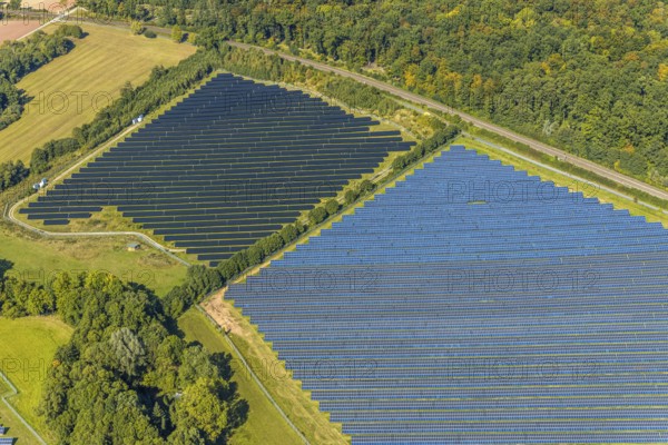 Aerial view, solar park, at the federal road B64, Herste, Bad Driburg, Ostwestfalen-Lippe, North Rhine-Westphalia, Germany, DE, Europe, shapes and colours, open space photovoltaic plant, aerial view, aerial photography, aerial photography, OLWBUCH, OWL, OWL-Buch, Ostwestfalen, photovoltaic, photovoltaic system, solar, solar system, solar energy, solar power plant, solar energy, overview, bird's-eye view, birds-eyes view, overview, alternative energy, renewable energy, solar panel