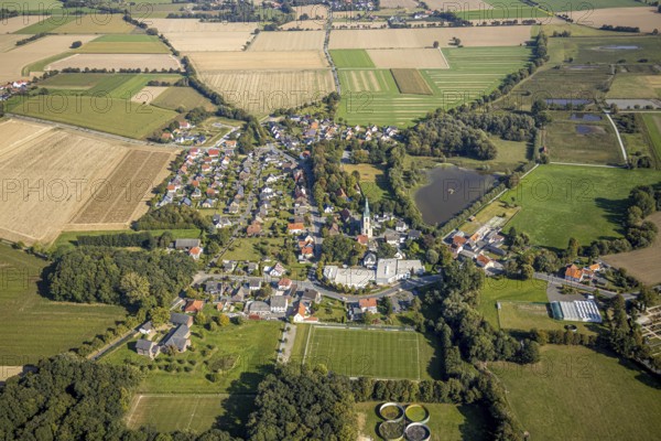 Aerial view, view of the town, St Christophorus parish church, Woestegraben pond, F. Schumacher Maschinenbauunternehmen, Ostinghausen, Bad Sassendorf, Kreis Soest, North Rhine-Westphalia, Germany, place of worship, City, DE, Europe, commercial enterprises, commercial area, commercial location, commercial use, religious community, place of worship, industrial area, industrial site, church, parish, Kirchstraße, denomination, Kreis-Soest-Buch, KreisSoestBuch, landscape conservation area Woeste, aerial view, aerial photography, aerial photography, religion, townscape, urban area, pond, overview, bird's-eye view, birds-eyes view, overview