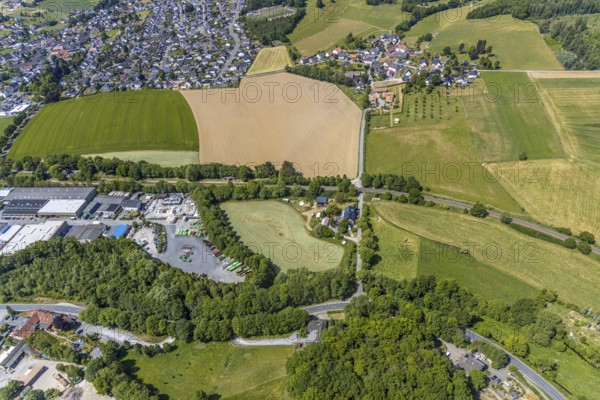 Aerial view, field at the industrial estate Am Pickhammer, Frühlinghausen, Balve, Sauerland, North Rhine-Westphalia, Germany, DE, Europe, commercial enterprises, commercial area, commercial park, commercial location, commercial use, industrial area, industrial location, aerial photograph, aerial photography, aerial photography, overview, bird's-eye view, meadows and fields, birds-eyes view, overview