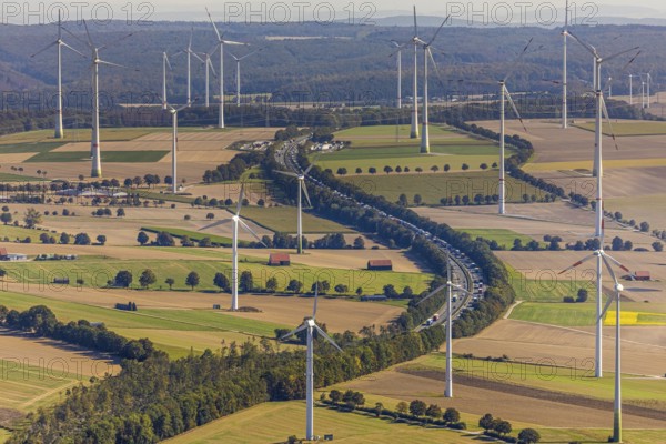 Aerial view, wind turbines, motorway A44, motorway service area Sintfeld, Wewelsburg, Büren, Ostwestfalen-Lippe, North Rhine-Westphalia, Germany, motorway service area, Bad Wünnenberg, DE, energy, energy industry, Europe, distant view, aerial view, aerial photography, aerial photography, OLWBUCH, OWL, OWL-Buch, Ostwestfalen, electricity, overview, bird's-eye view, WEA, meadows and fields, wind energy, wind energy plant, wind farm, wind power, wind power plant, wind park, birds-eyes view, overview