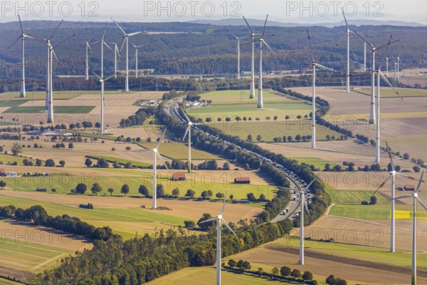Aerial view, wind turbines, motorway A44, motorway service area Sintfeld, Wewelsburg, Büren, Ostwestfalen-Lippe, North Rhine-Westphalia, Germany, motorway service area, Bad Wünnenberg, DE, energy, energy industry, Europe, distant view, aerial view, aerial photography, aerial photography, OLWBUCH, OWL, OWL-Buch, Ostwestfalen, electricity, overview, bird's-eye view, WEA, meadows and fields, wind energy, wind energy plant, wind farm, wind power, wind power plant, wind park, birds-eyes view, overview