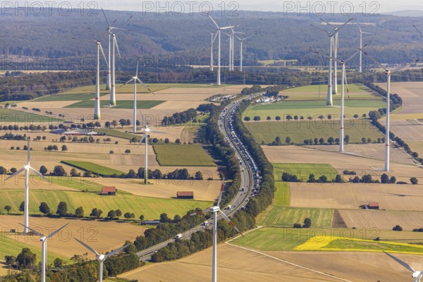 Aerial view, wind turbines, motorway A44, motorway service area Sintfeld, Wewelsburg, Büren, Ostwestfalen-Lippe, North Rhine-Westphalia, Germany, motorway service area, Bad Wünnenberg, DE, energy, energy industry, Europe, distant view, aerial view, aerial photography, aerial photography, OLWBUCH, OWL, OWL-Buch, Ostwestfalen, electricity, overview, bird's-eye view, WEA, meadows and fields, wind energy, wind energy plant, wind farm, wind power, wind power plant, wind park, birds-eyes view, overview