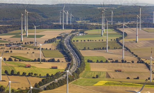 Aerial view, wind turbines, motorway A44, motorway service area Sintfeld, Wewelsburg, Büren, Ostwestfalen-Lippe, North Rhine-Westphalia, Germany, motorway service area, Bad Wünnenberg, DE, energy, energy industry, Europe, distant view, aerial view, aerial photography, aerial photography, OLWBUCH, OWL, OWL-Buch, Ostwestfalen, electricity, overview, bird's-eye view, WEA, meadows and fields, wind energy, wind energy plant, wind farm, wind power, wind power plant, wind park, birds-eyes view, overview