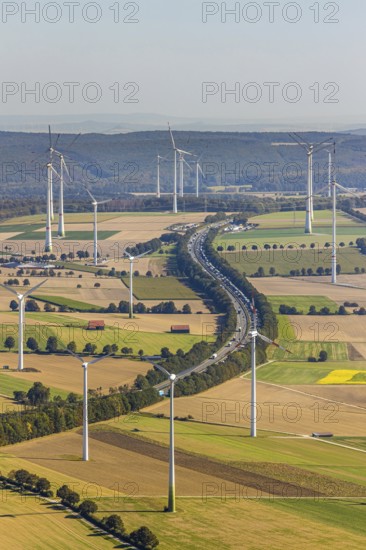 Aerial view, wind turbines, motorway A44, motorway service area Sintfeld, Wewelsburg, Büren, Ostwestfalen-Lippe, North Rhine-Westphalia, Germany, motorway service area, Bad Wünnenberg, DE, energy, energy industry, Europe, distant view, aerial view, aerial photography, aerial photography, OLWBUCH, OWL, OWL-Buch, Ostwestfalen, electricity, overview, bird's-eye view, WEA, meadows and fields, wind energy, wind energy plant, wind farm, wind power, wind power plant, wind park, birds-eyes view, overview