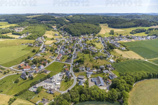 Aerial view, local view district Beckum, catholic church St. Nikolaus, Balve, Sauerland, North Rhine-Westphalia, Germany, place of worship, federal road B229, DE, Europe, religious community, place of worship, property tax, real estate, church, parish, denomination, aerial view, aerial photography, aerial photography, overview, bird's eye view, forest area, living and life, residential area, residential buildings, residential quality, housing estate, birds-eyes view, overview