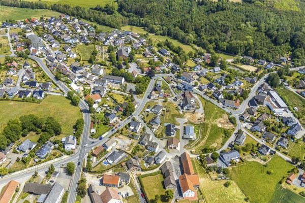 Aerial view, Local view Langenholthausen, Goldbäckerei Grote GmbH, Sunderner Straße, SoKoLa.de, former Städt. Community primary school, Balve, Sauerland, North Rhine-Westphalia, Germany, place of worship, DE, Europe, commercial enterprises, commercial space, commercial location, commercial use, religious community, place of worship, Grote bakery, church, parish, denomination, aerial view, aerial photography, aerial photography, St. Johannes Kirche Langenholthausen, overview, events, venue, event location, bird's-eye view, birds-eyes view, cultural use, overview, Langenholthausen