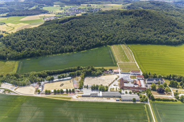Aerial view, equestrian centre Reiterverein Balve, Schloss Wocklum, Balve, Sauerland, North Rhine-Westphalia, Germany, DE, Europe, manor house, manor house, manor building, courtyard, aerial view, aerial photography, aerial photography, horses, equestrian sports, equestrian centre, riding stable, riding club, riding stable, castle, castle garden, overview, defence system, bird's eye view, forest area, moated castle, moated castle, meadows and fields, Wocklum, birds-eyes view, overview