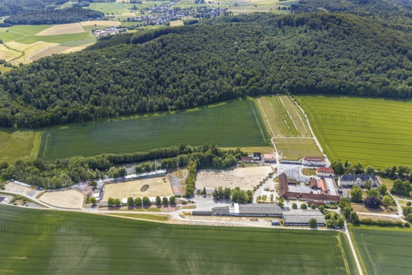Aerial view, equestrian centre Reiterverein Balve, Schloss Wocklum, Balve, Sauerland, North Rhine-Westphalia, Germany, DE, Europe, manor house, manor house, manor building, courtyard, aerial view, aerial photography, aerial photography, horses, equestrian sports, equestrian centre, riding stable, riding club, riding stable, castle, castle garden, overview, defence system, bird's eye view, forest area, moated castle, moated castle, meadows and fields, Wocklum, birds-eyes view, overview