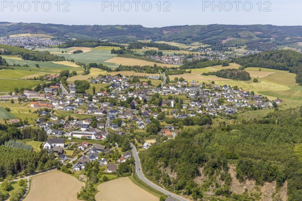 Aerial view, view of Langenholthausen, Goldbäckerei Grote GmbH, Sunderner Straße, St. Johannes Kirche Langenholthausen, Balve, Sauerland, North Rhine-Westphalia, Germany, place of worship, DE, Europe, commercial enterprises, commercial area, commercial location, commercial use, religious community, place of worship, Grote bakery, church, parish, denomination, aerial view, aerial photography, aerial photography, overview, bird's-eye view, birds-eyes view, overview, Langenholthausen