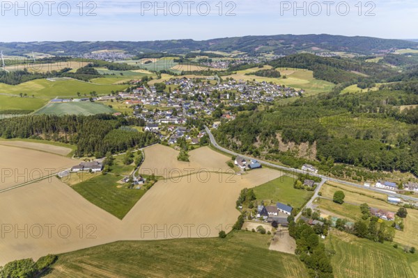 Aerial view, view of Langenholthausen, Goldbäckerei Grote GmbH, Sunderner Straße, St. Johannes Kirche Langenholthausen, Balve, Sauerland, North Rhine-Westphalia, Germany, place of worship, DE, Europe, commercial enterprises, commercial area, commercial location, commercial use, religious community, place of worship, Grote bakery, church, parish, denomination, aerial view, aerial photography, aerial photography, overview, bird's-eye view, birds-eyes view, overview, Langenholthausen