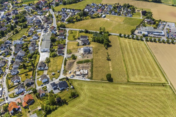 Aerial view, construction site residential buildings Kurze Straße, Opel car dealership Carl Bichmann, Aral petrol station, Balve, Sauerland, North Rhine-Westphalia, Germany, construction work, construction area, building site, building plots, construction project, construction site, DE, Europe, shapes and colours, aerial view, aerial photography, aerial photography, new building, Schramm & Verbecke oHG manufacturer, overview, bird's-eye view, overview, Langenholthausen