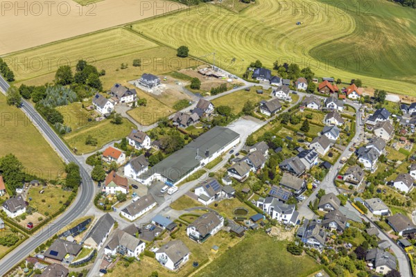 Aerial photo, Schramm & Verbecke oHG manufacturer, Neuenrader Straße, Balve, Sauerland, North Rhine-Westphalia, Germany, DE, Europe, commercial enterprises, commercial area, commercial area, commercial location, commercial use, property tax, real estate, industrial location, aerial photograph, aerial photography, aerial photography, tractor mowing meadow, overview, bird's eye view, meadows and fields, residential area, housing and living, residential area, residential buildings, housing estate, birds-eyes view, overview, Langenholthausen