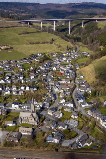 Aerial view, aerial view Nuttlar, viaduct Nuttlar, motorway A46, Bestwig, North Rhine-Westphalia, Germany, DE, Europe, religious community, place of worship, property tax, hilly landscape, real estate, church, parish, denomination, aerial view, aerial photography, aerial photography, religion, overview, bird's eye view, forest, meadows and fields, living and life, residential area, residential buildings, birds-eyes view, catholic church St. Anna Nuttlar, overview