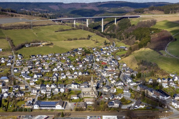 Aerial view, aerial view Nuttlar, viaduct Nuttlar, motorway A46, Bestwig, North Rhine-Westphalia, Germany, DE, Europe, religious community, place of worship, property tax, hilly landscape, real estate, church, parish, denomination, aerial view, aerial photography, aerial photography, religion, overview, bird's eye view, forest, meadows and fields, living and life, residential area, residential buildings, birds-eyes view, catholic church St. Anna Nuttlar, overview