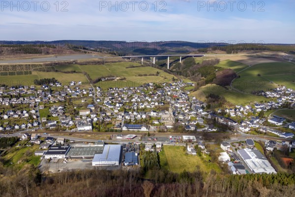 Aerial view, aerial view Nuttlar, valley bridge Nuttlar, motorway A46, Bestwig, North Rhine-Westphalia, Germany, federal road B7, DE, Europe, religious community, place of worship, property tax, hilly landscape, real estate, church, parish, denomination, aerial view, aerial photography, aerial photography, religion, overview, bird's eye view, forest, meadows and fields, living and life, residential area, residential buildings, birds-eyes view, catholic church St. Anna Nuttlar, overview