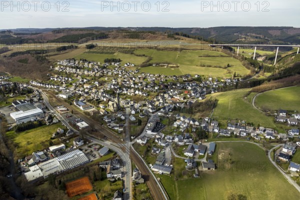 Aerial view, aerial view Nuttlar, valley bridge Nuttlar, motorway A46, Bestwig, North Rhine-Westphalia, Germany, federal road B7, DE, Europe, religious community, place of worship, property tax, hilly landscape, real estate, church, parish, denomination, aerial view, aerial photography, aerial photography, religion, overview, bird's eye view, forest, meadows and fields, living and life, residential area, residential buildings, birds-eyes view, catholic church St. Anna Nuttlar, overview