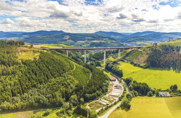 Aerial view, Nuttlar viaduct, motorway A46, Garten- und Landschaftsbau Hans-Gerd Meschede KG, Bestwig, Sauerland, North Rhine-Westphalia, Germany, view to Nuttlar, bridge, DE, Europe, commercial enterprises, commercial area, industrial area, commercial location, commercial use, hilly landscape, industrial area, industrial site, aerial view, aerial photography, aerial photography, Rüthener Straße, valley bridge Nuttlar A46, overview, bird's-eye view, forest, forest area, meadows and fields, birds-eyes view, overview