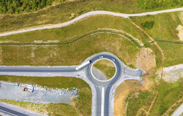Aerial view, motorway A46, Nuttlar junction B480n, hilly landscape, Bestwig, North Rhine-Westphalia, Germany, motorway A46 extension, construction work, construction area, construction site, construction measure, construction project, construction site, federal road B480n, DE, Europe, roundabout, aerial view, aerial photography, aerial photography, new construction, Nuttlar, Sauerland, overview, bird's eye view, forest area, meadows and fields, birds-eyes view, overview