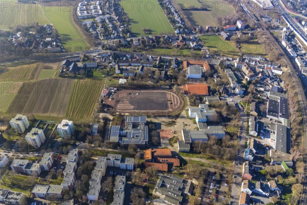 Aerial view, sports centre Westenfeld, construction site sports field, primary school Westenfeld, Hellweg-Schule Städt. Gymnasium, Maria-Sibylla-Merian-Gesamtschule, St.Nikolaus Kindergarten, Westenfeld, Bochum, Ruhr area, North Rhine-Westphalia, Germany, education, educational institution, DE, Europe, comprehensive school, primary school, primary tax, grammar school, real estate, kindergarten, teaching institute, aerial photograph, aerial photography, aerial photography, school, overview, bird's eye view, residential complex, living and life, residential area, residential buildings, housing estate, birds-eyes view, overview