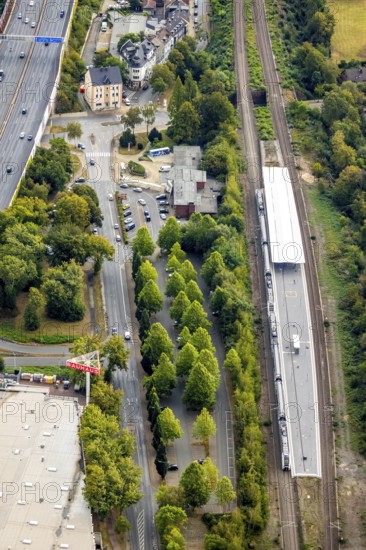 Aerial view, Wattenscheid railway station, motorway exit Bochum-Wattenscheid, Westenfeld, Bochum, Ruhr area, North Rhine-Westphalia, Germany, motorway A40, railway tracks, railway station, station forecourt, Bochum-Wattenscheid, DE, Deutsche Bahn AG, Europe, green trees, main station, aerial view, aerial photography, aerial photography, Wattenscheid district, overview, bird's eye view, Wattenscheid, birds-eyes view, overview
