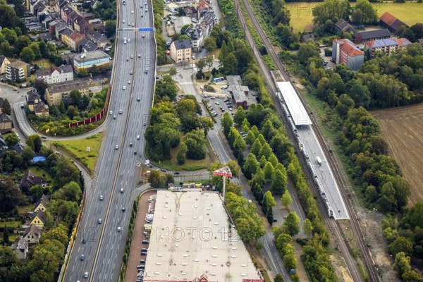 Aerial view, Wattenscheid railway station, motorway exit Bochum-Wattenscheid, Westenfeld, Bochum, Ruhr area, North Rhine-Westphalia, Germany, motorway A40, railway tracks, railway station, station forecourt, Bochum-Wattenscheid, DE, Deutsche Bahn AG, Europe, green trees, main station, aerial view, aerial photography, aerial photography, Wattenscheid district, overview, bird's eye view, Wattenscheid, birds-eyes view, overview
