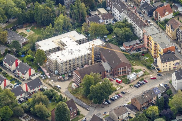 Aerial view, construction site new building Ludwig-Steil-Haus, senior centre, Wattenscheid, Bochum, Ruhr area, North Rhine-Westphalia, Germany, retirement home, construction work, building, construction area, building site, building plot, building crane, construction project, construction site, care and nursing, Bochum-Wattenscheid, DE, monument protection, Europe, aerial view, aerial photography, aerial photography, new building, nursing facility, retirement home, retirement residence, retirement home, senior centre Ludwig-Steil GmbH & Co. KG, Wattenscheid district, overview, bird's-eye view, birds-eyes view, overview